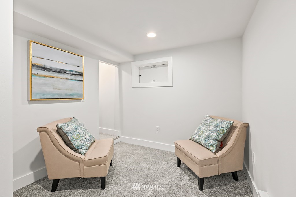 4906 Southwest Hinds Street Seattle, WA 98116 - Photo 20 of 40 a living room with furniture and a window