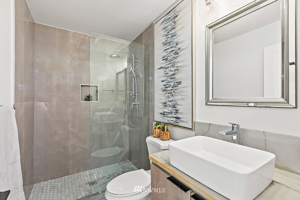 4906 Southwest Hinds Street Seattle, WA 98116 - Photo 25 of 40 a bathroom with a sink toilet and shower