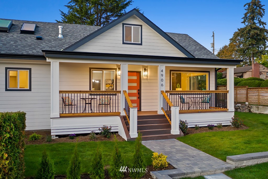4906 Southwest Hinds Street Seattle, WA 98116 - Photo 4 of 40 a front view of a house with a yard