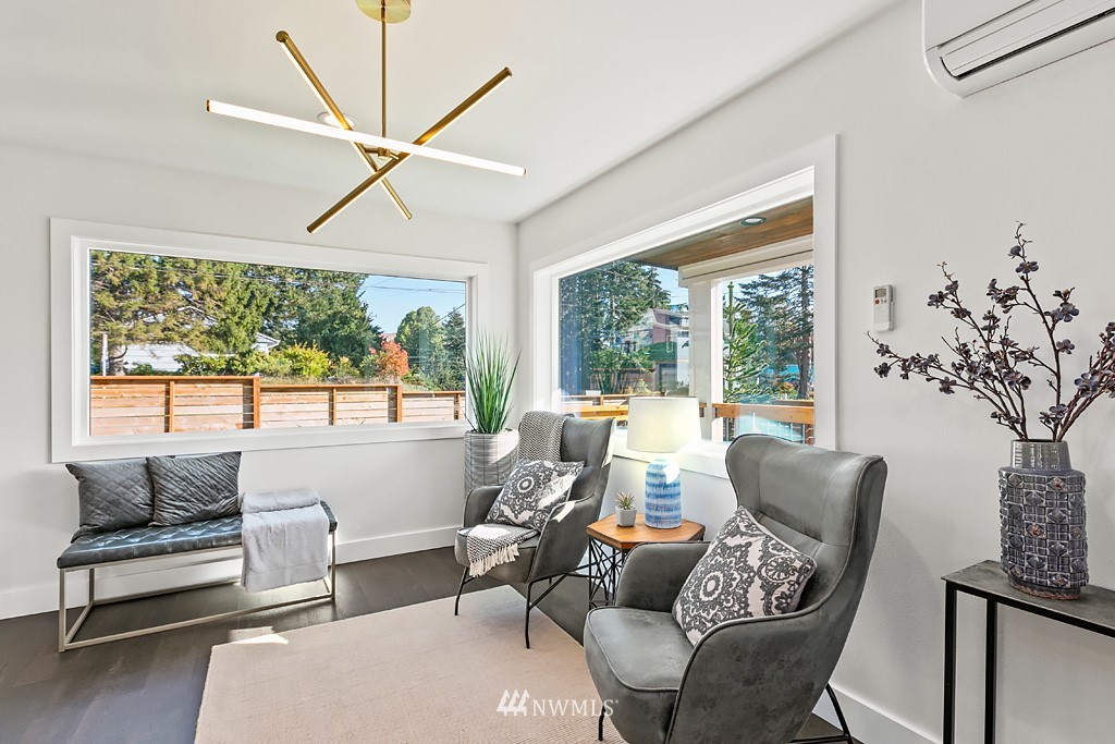 4906 Southwest Hinds Street Seattle, WA 98116 - Photo 31 of 40 a living room with furniture and a large window