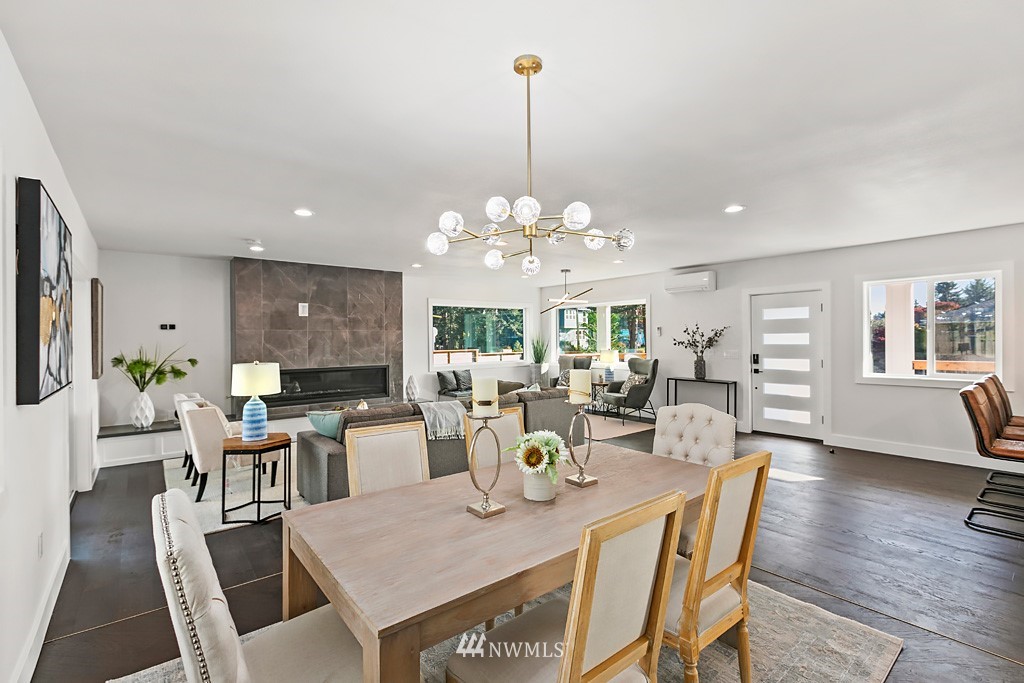 4906 Southwest Hinds Street Seattle, WA 98116 - Photo 35 of 40 a view of a dining room with furniture window and wooden floor