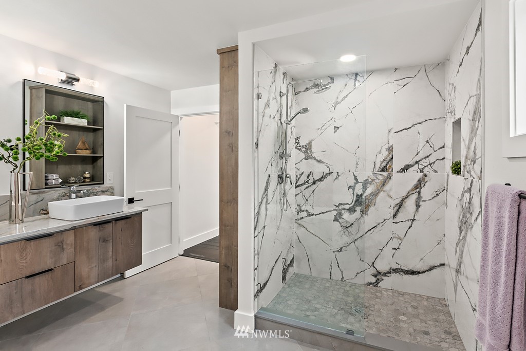4906 Southwest Hinds Street Seattle, WA 98116 - Photo 9 of 40 a bathroom with a shower and a sink