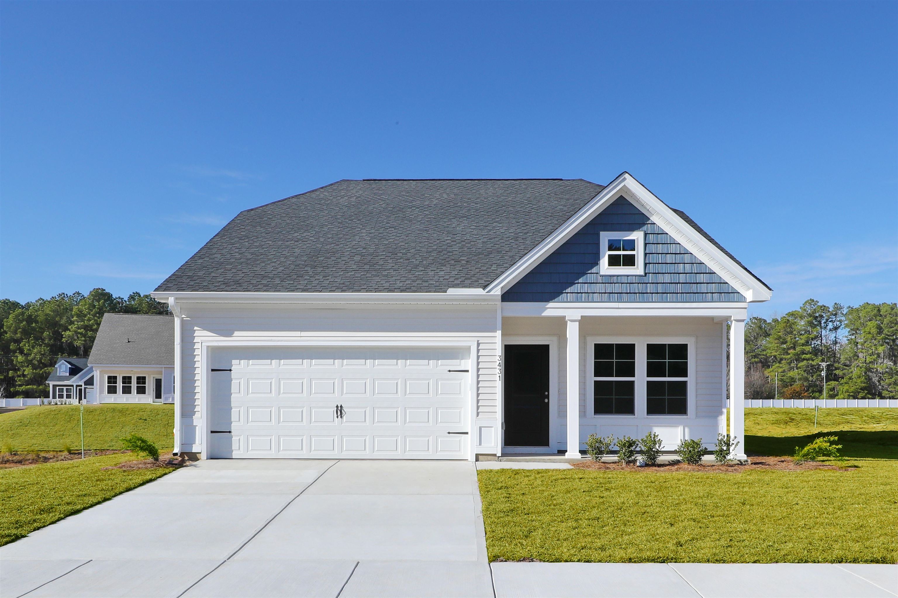 3431 Logan Street Conway, SC 29526 - Photo 1 of 31 View of front facade with a front lawn, concrete driveway, covered porch, an attached garage, and roof with shingles