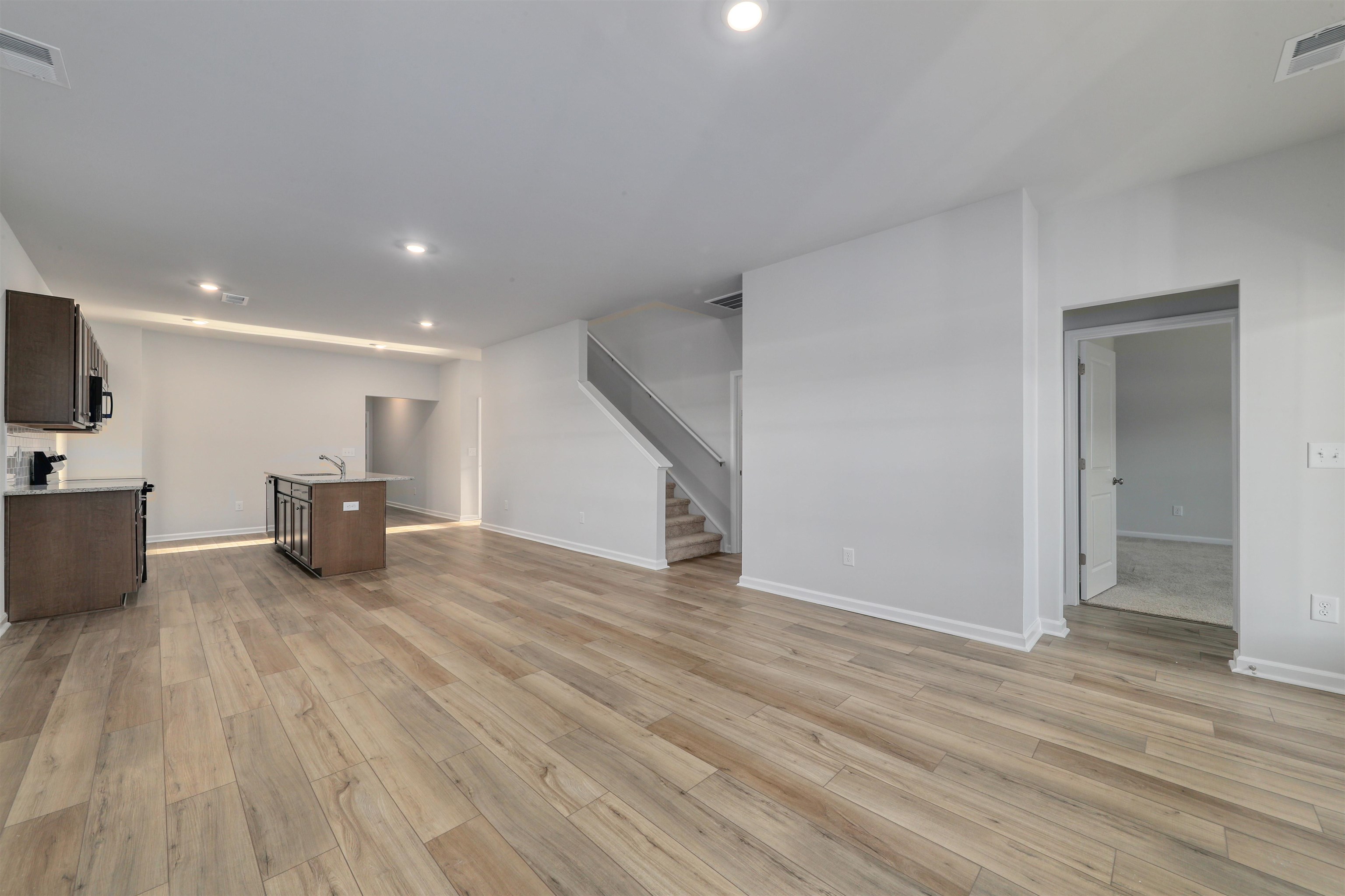 3431 Logan Street Conway, SC 29526 - Photo 16 of 31 Unfurnished living room with stairway, recessed lighting, and light wood finished floors