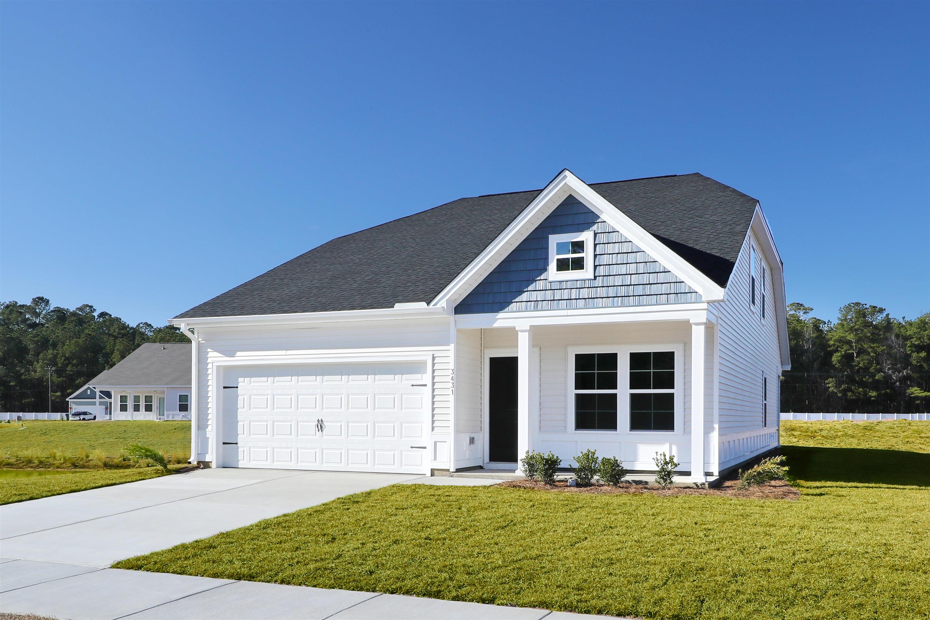3431 Logan Street Conway, SC 29526 - Photo 2 of 31 View of front of home with a front yard, driveway, an attached garage, and roof with shingles