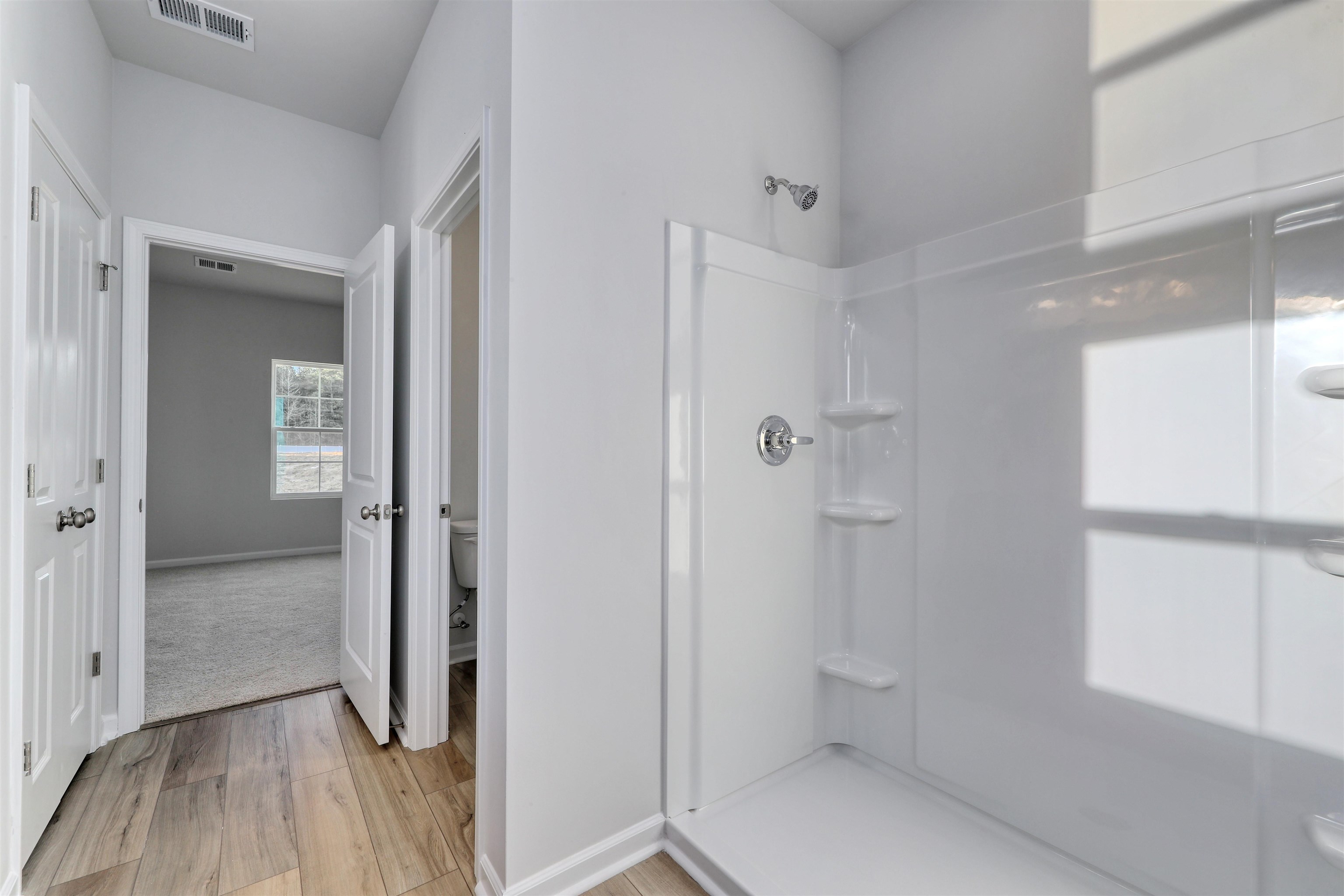 3431 Logan Street Conway, SC 29526 - Photo 23 of 31 Bathroom featuring a shower stall and light wood-style floors