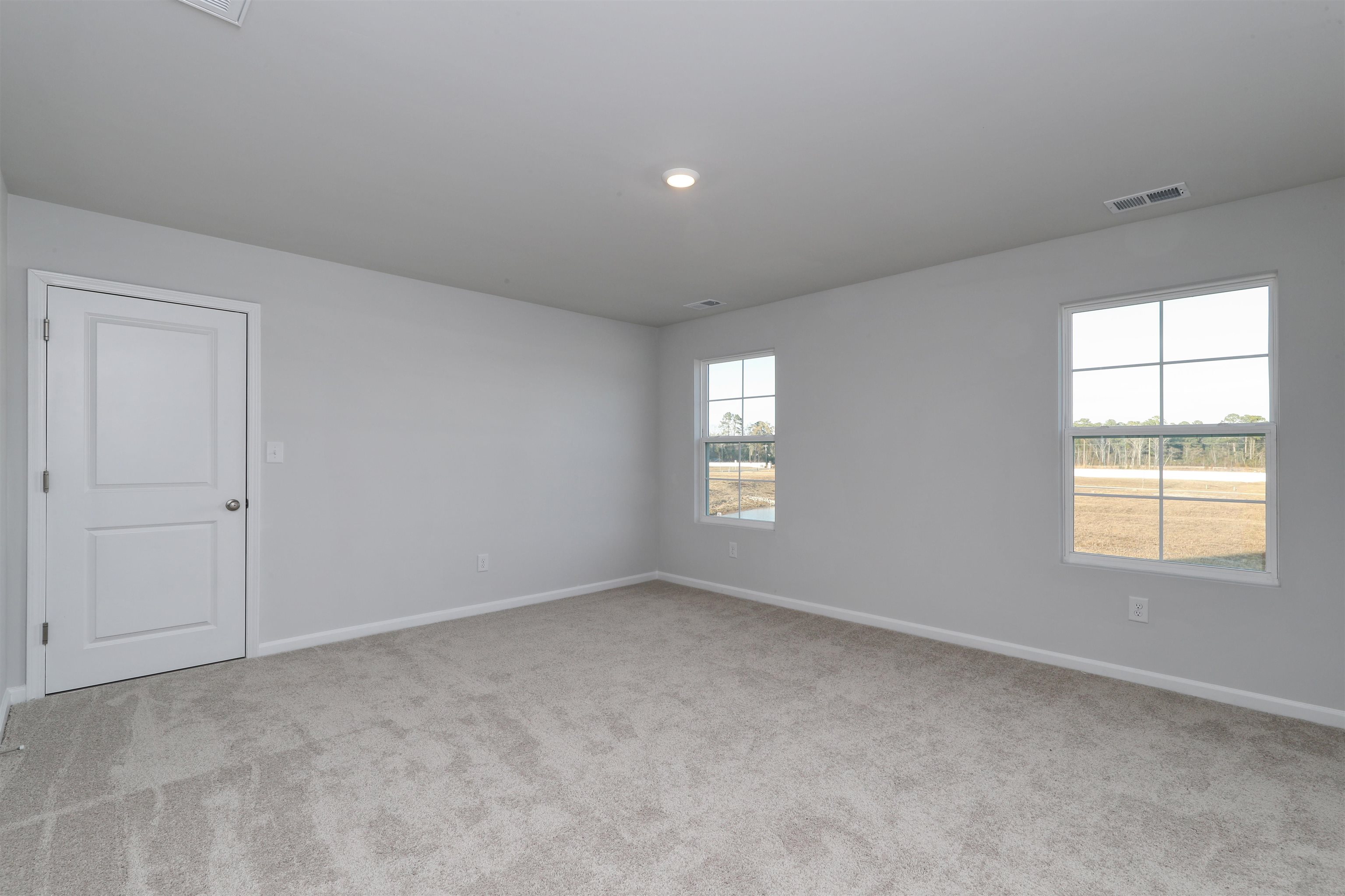 3431 Logan Street Conway, SC 29526 - Photo 24 of 31 Empty room featuring baseboards and light colored carpet
