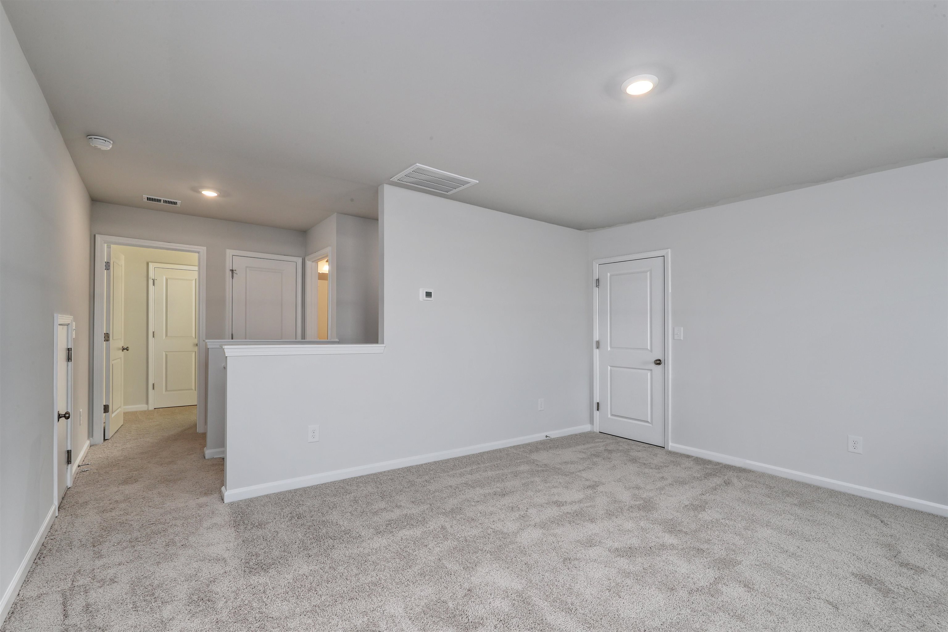 3431 Logan Street Conway, SC 29526 - Photo 25 of 31 Spare room featuring light colored carpet and recessed lighting
