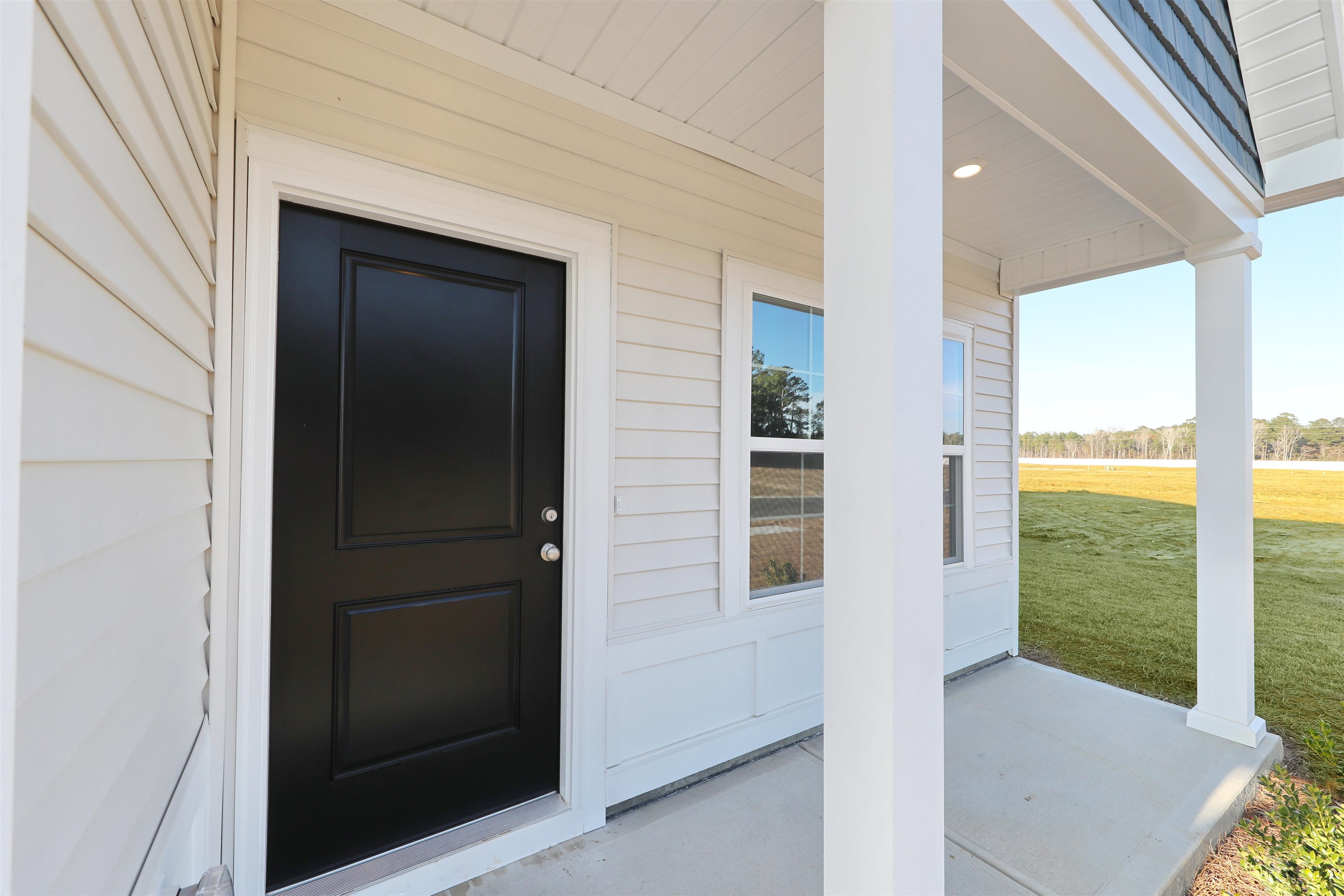 3431 Logan Street Conway, SC 29526 - Photo 29 of 31 Doorway to property featuring covered porch and a yard