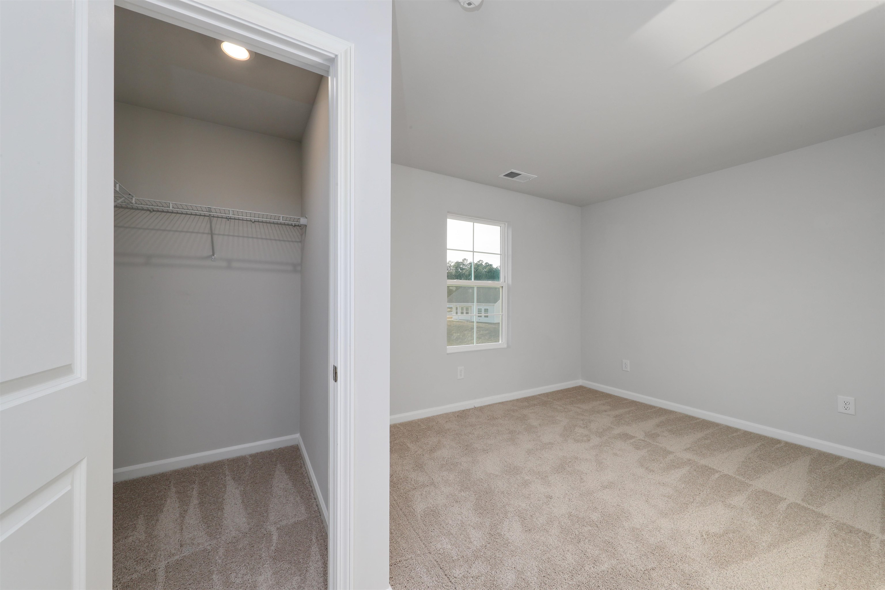 3431 Logan Street Conway, SC 29526 - Photo 3 of 31 Unfurnished bedroom featuring light colored carpet and a closet