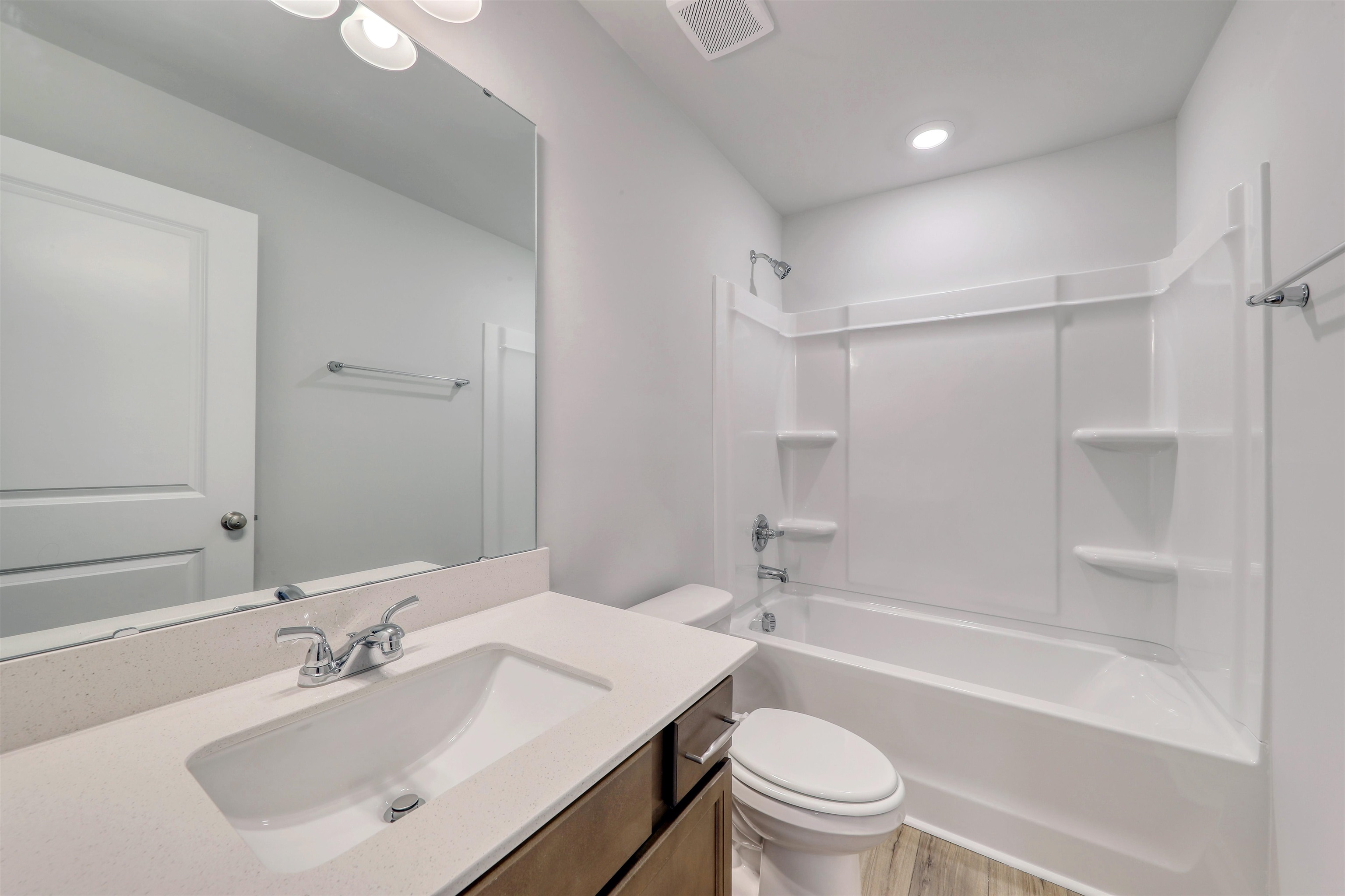 3431 Logan Street Conway, SC 29526 - Photo 6 of 31 Full bathroom with bathing tub / shower combination, vanity, and light wood finished floors