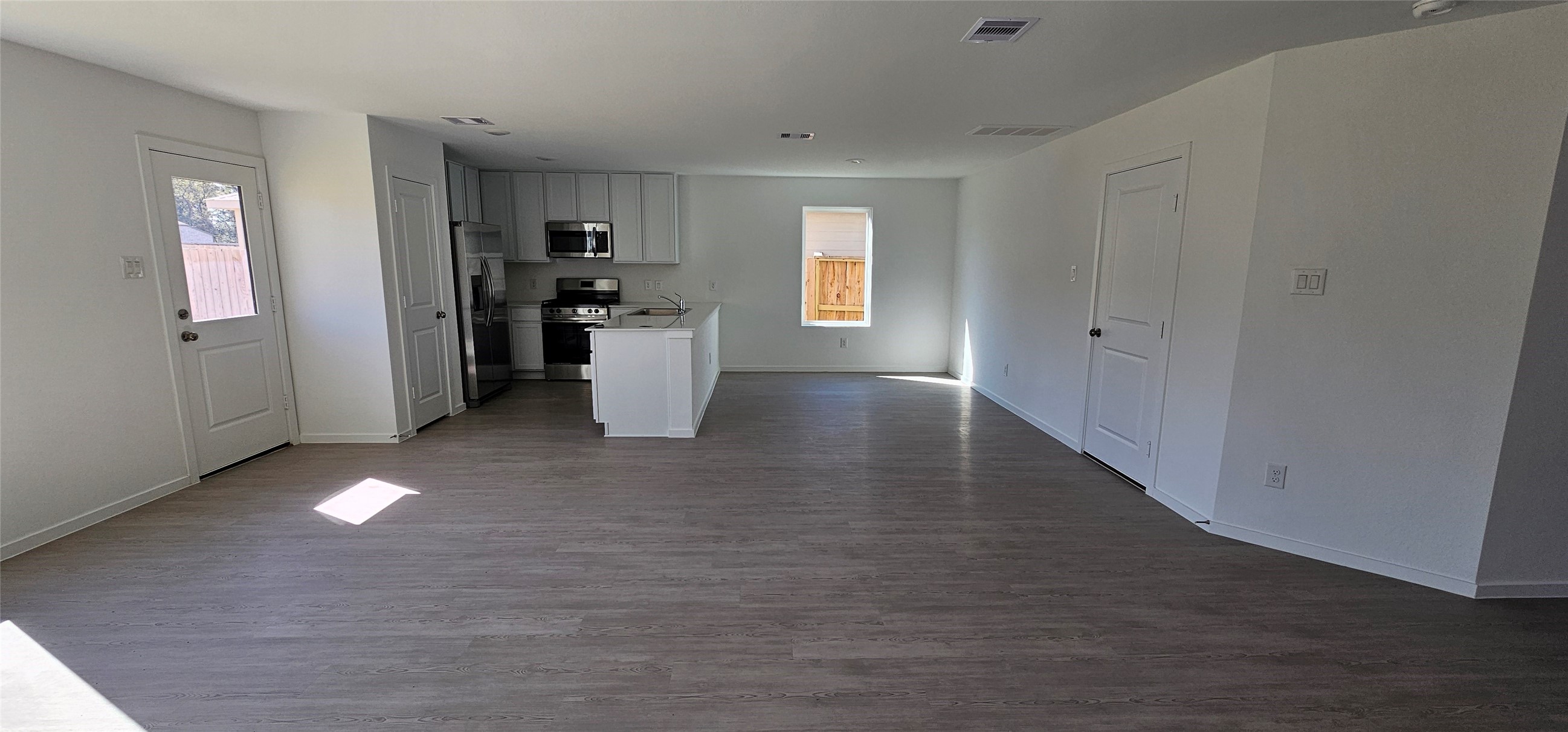 21310 Offida Lane New Caney, TX 77357 - Photo 21 of 24 a view of a kitchen with refrigerator and windows