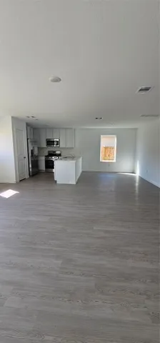 a room with a bed and cabinets