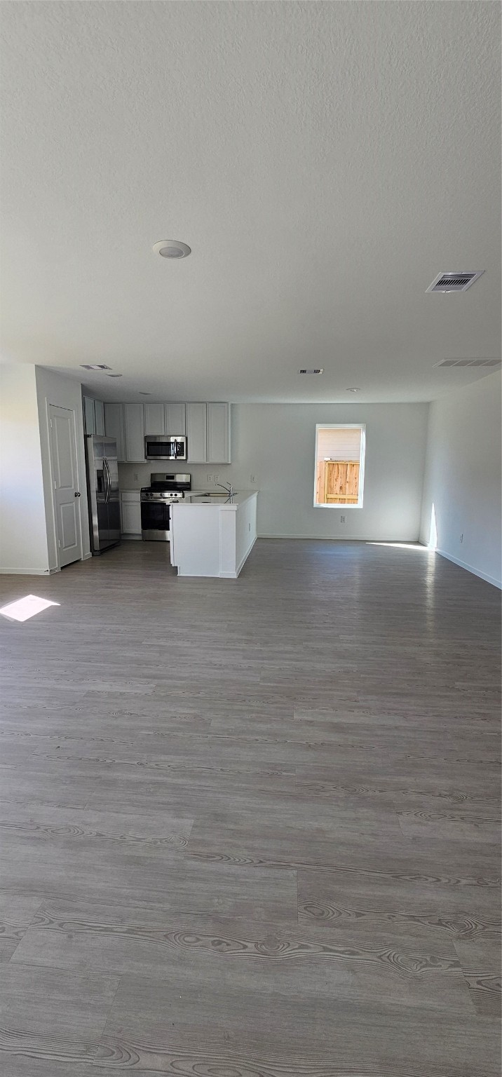 21310 Offida Lane New Caney, TX 77357 - Photo 23 of 24 a room with a bed and cabinets