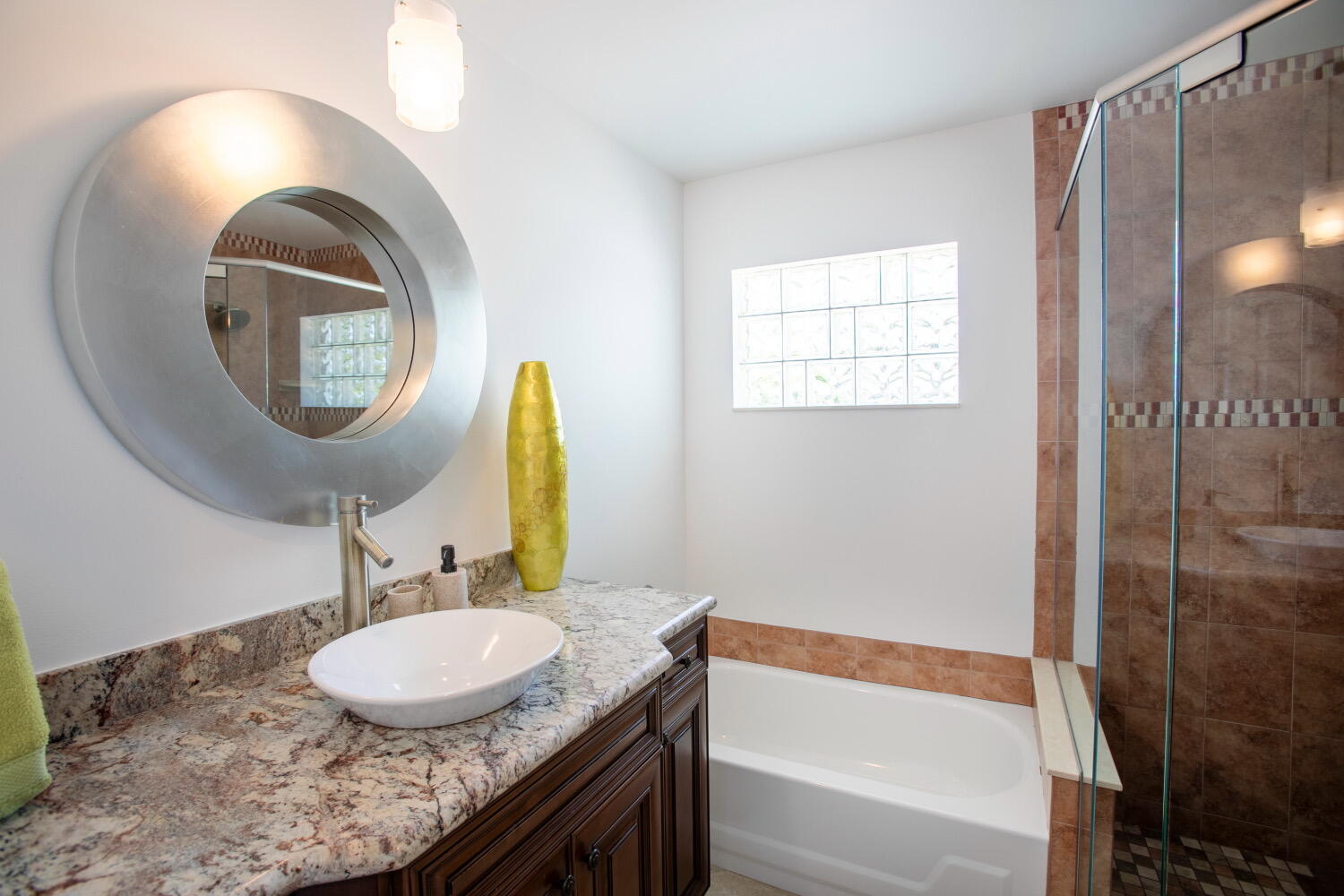 2631 Northeast 48th Street Lighthouse Point, FL 33064 - Photo 13 of 26 a bathroom with a granite countertop sink and a mirror