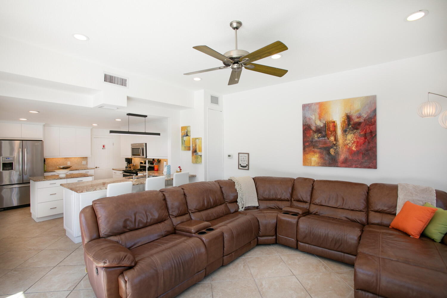 2631 Northeast 48th Street Lighthouse Point, FL 33064 - Photo 25 of 26 a living room with furniture kitchen view and a chandelier