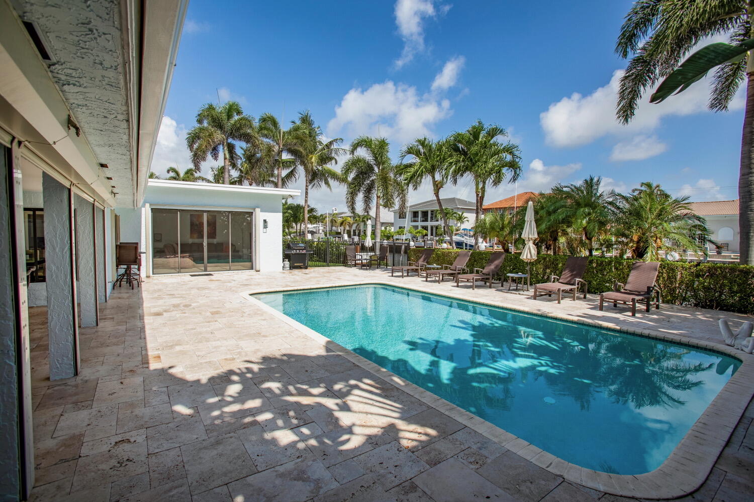 2631 Northeast 48th Street Lighthouse Point, FL 33064 - Photo 3 of 26 a swimming pool with outdoor seating and yard