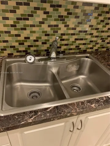 a backyard of a house with lots of green space and trees