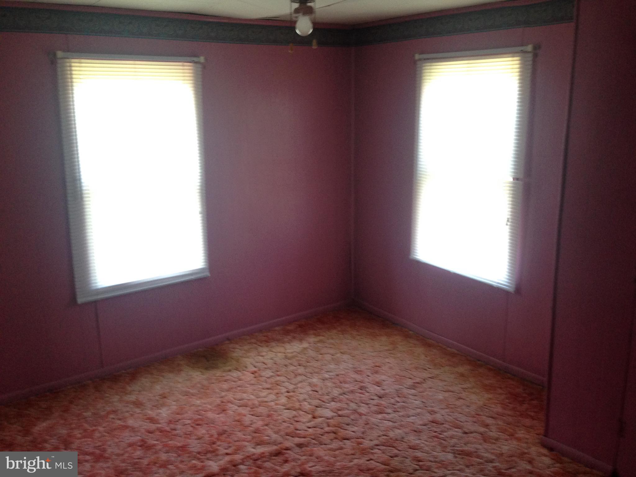 8321 Newark Road Newark, MD 21841 - Photo 8 of 33 an empty room with a window