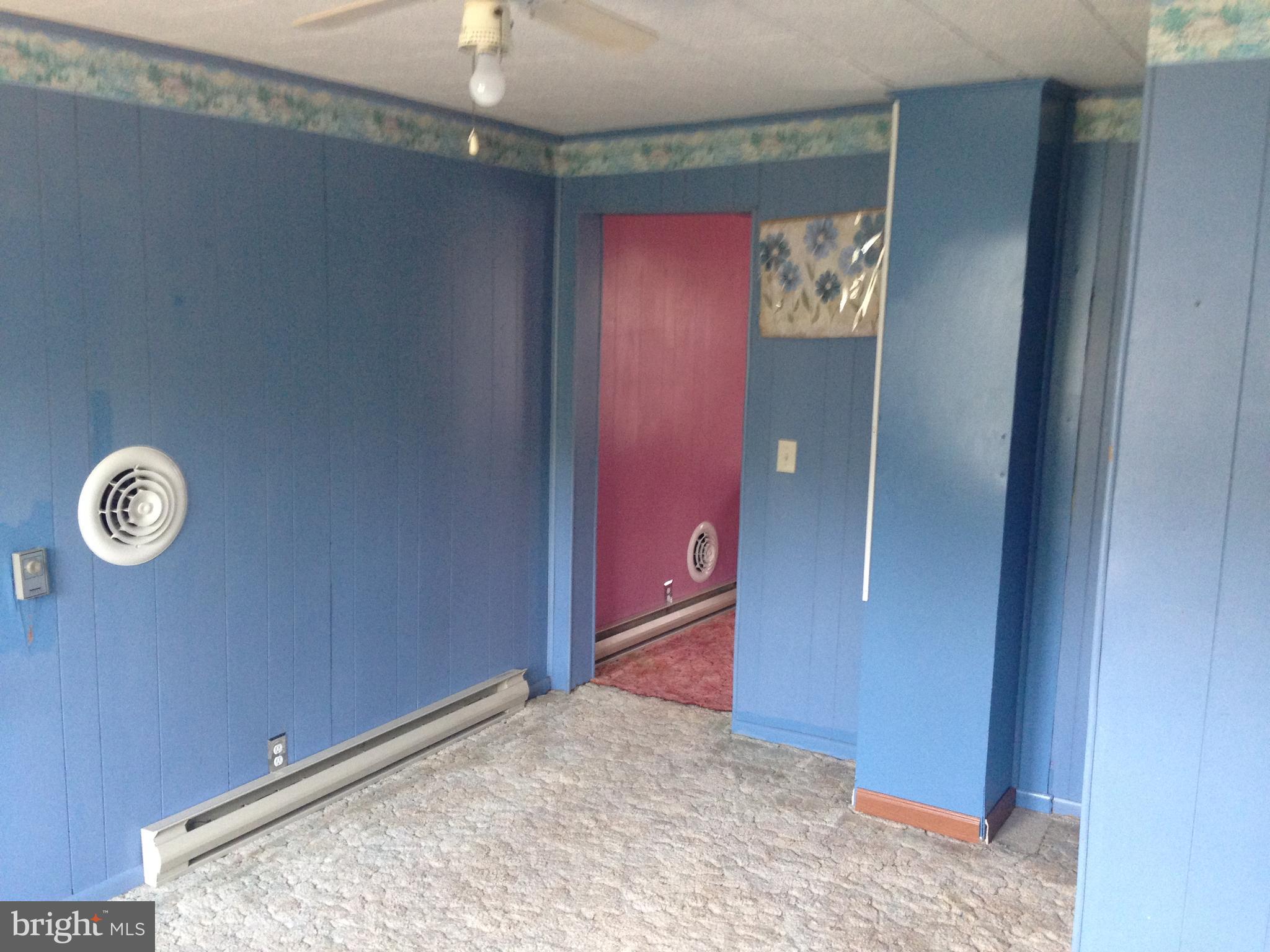 8321 Newark Road Newark, MD 21841 - Photo 10 of 33 an empty room with fan
