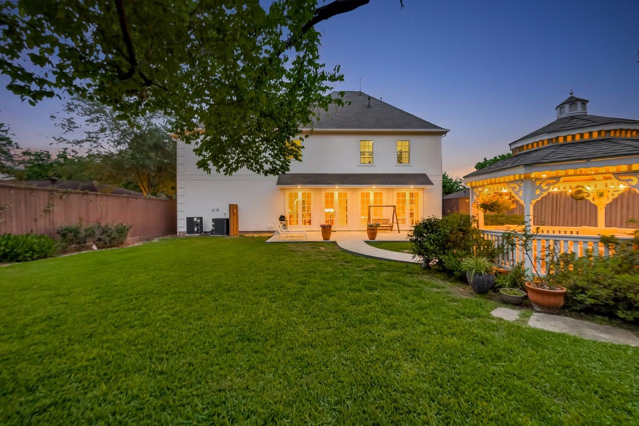10932 Lasso Lane Houston, TX 77079 - Photo 35 of 38 a front view of house with yard and green space