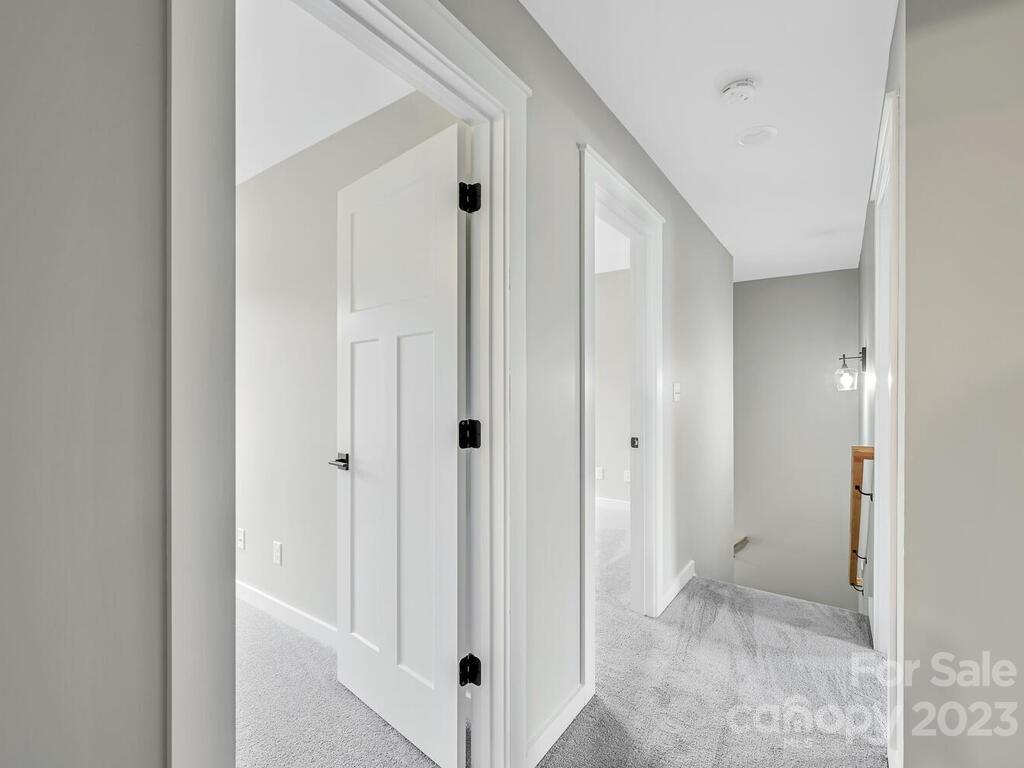 921 Newfound Road Leicester, NC 28748 - Photo 18 of 28 a view of a hallway with closet area