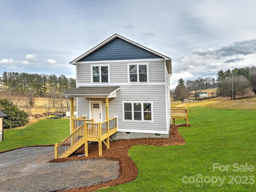 921 Newfound Road Leicester, NC 28748 - Photo 2 of 28 a house view with a garden space