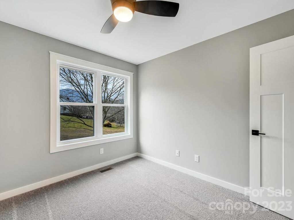 921 Newfound Road Leicester, NC 28748 - Photo 21 of 28 an empty room with windows