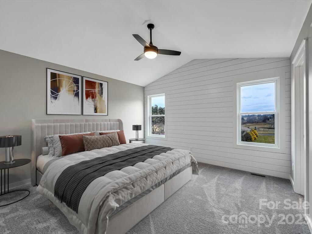 921 Newfound Road Leicester, NC 28748 - Photo 24 of 28 a bedroom with a large bed and a window