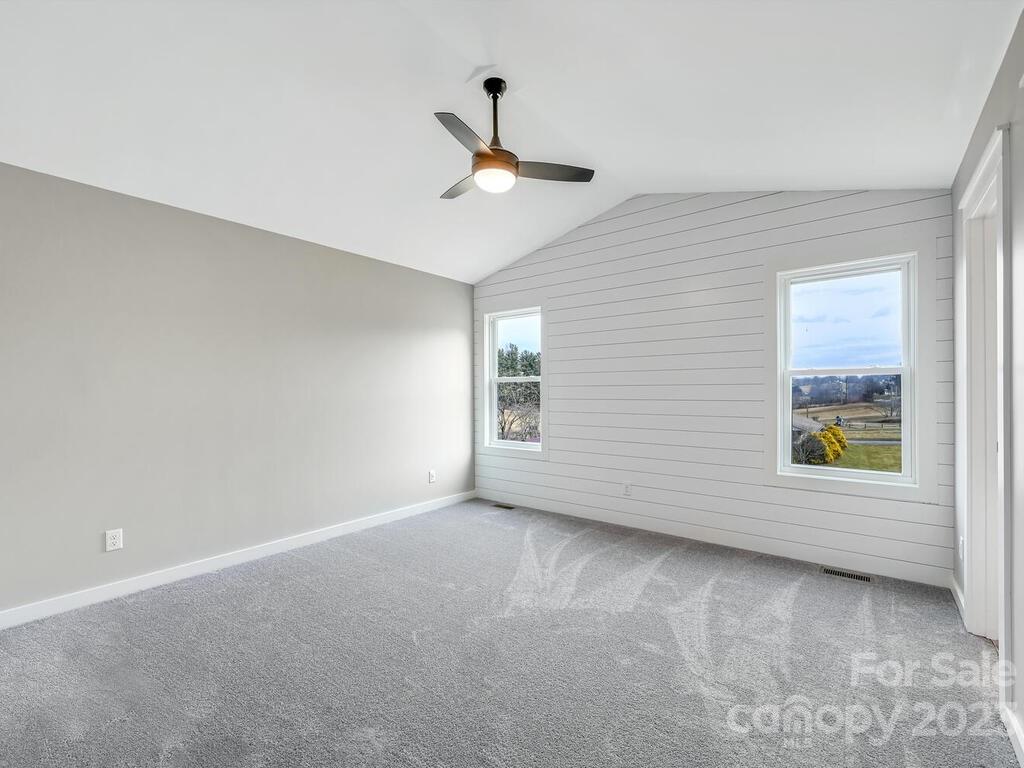 921 Newfound Road Leicester, NC 28748 - Photo 25 of 28 a view of an empty room with a window