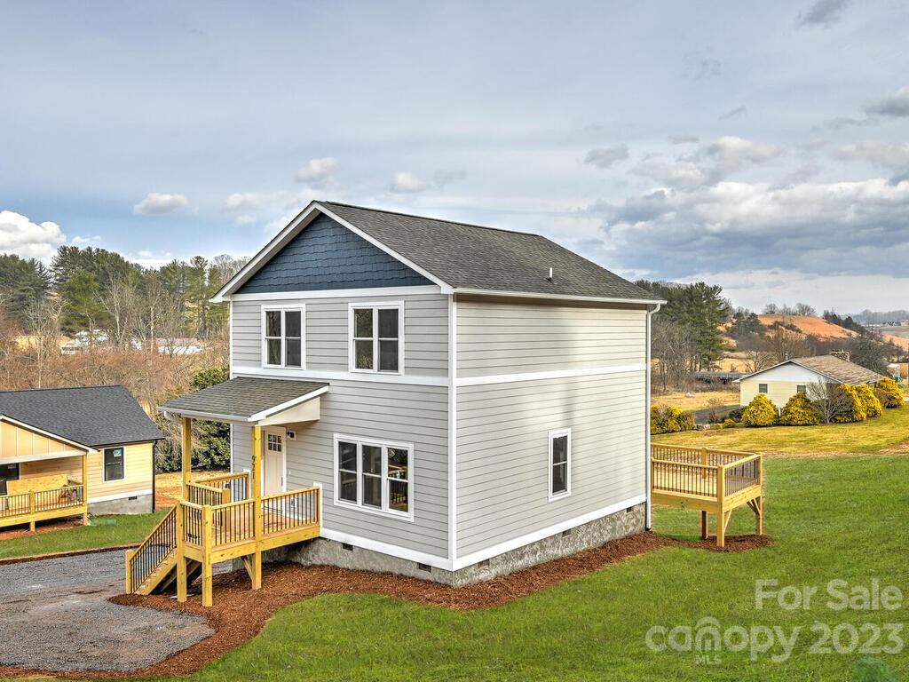921 Newfound Road Leicester, NC 28748 - Photo 3 of 28 a front view of a house with a yard