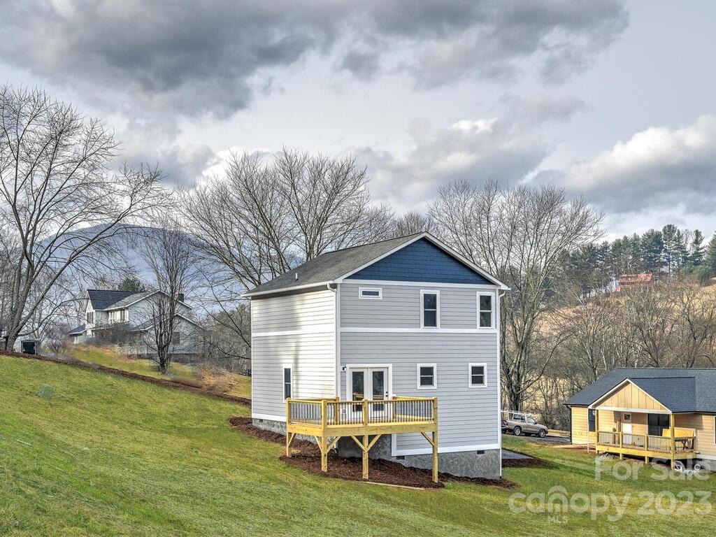 921 Newfound Road Leicester, NC 28748 - Photo 5 of 28 a front view of a house with garden
