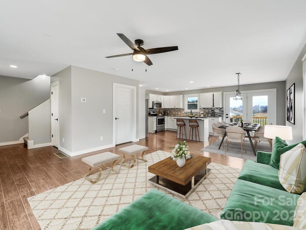 921 Newfound Road Leicester, NC 28748 - Photo 6 of 28 a living room with lots of furniture and view of kitchen