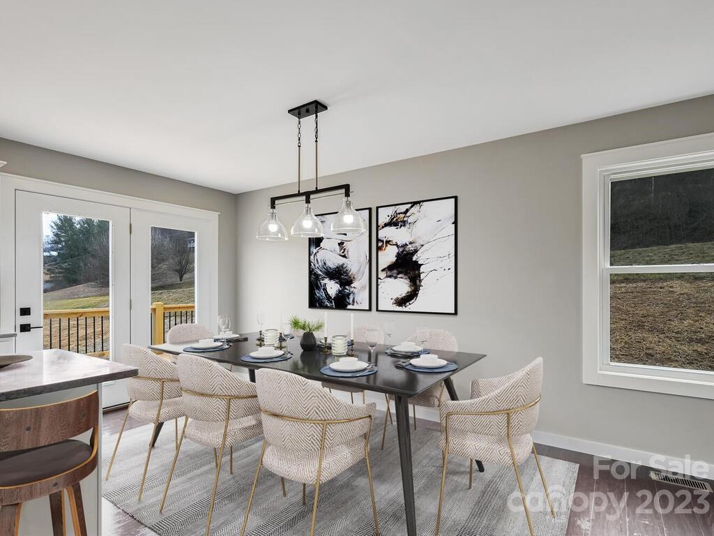 921 Newfound Road Leicester, NC 28748 - Photo 7 of 28 a view of a dining room with furniture window and outside view