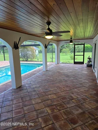 a view of a room with porch and wooden floor