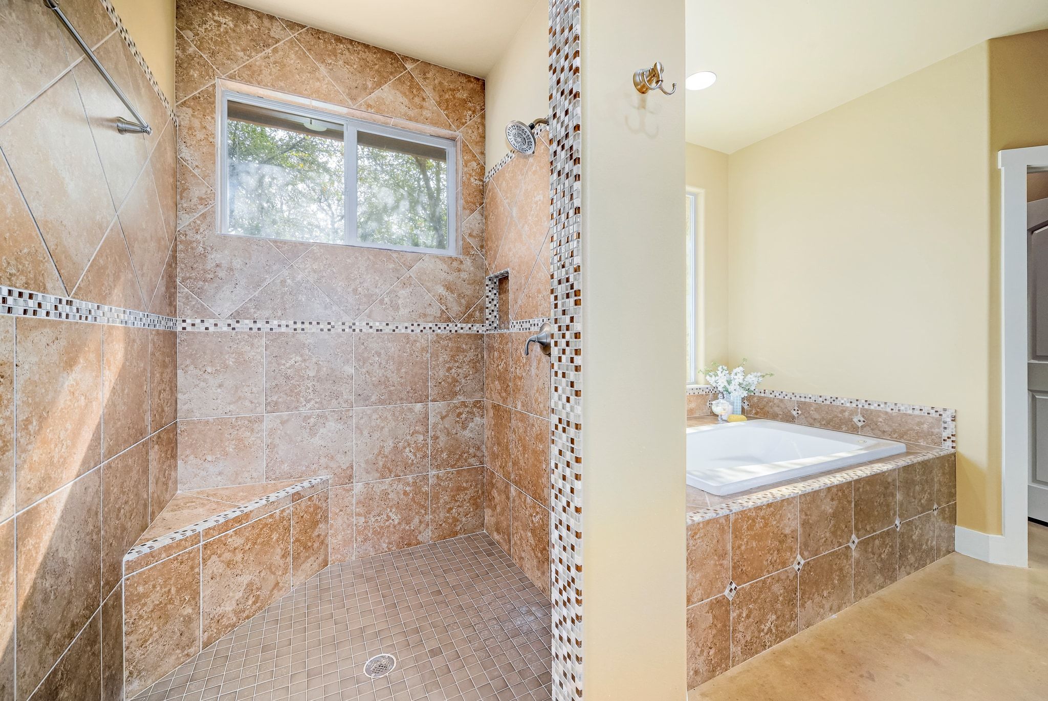 2551 Wolf Creek Ranch Road Burnet, TX 78611 - Photo 17 of 40 Bathroom featuring a bath and a tile shower