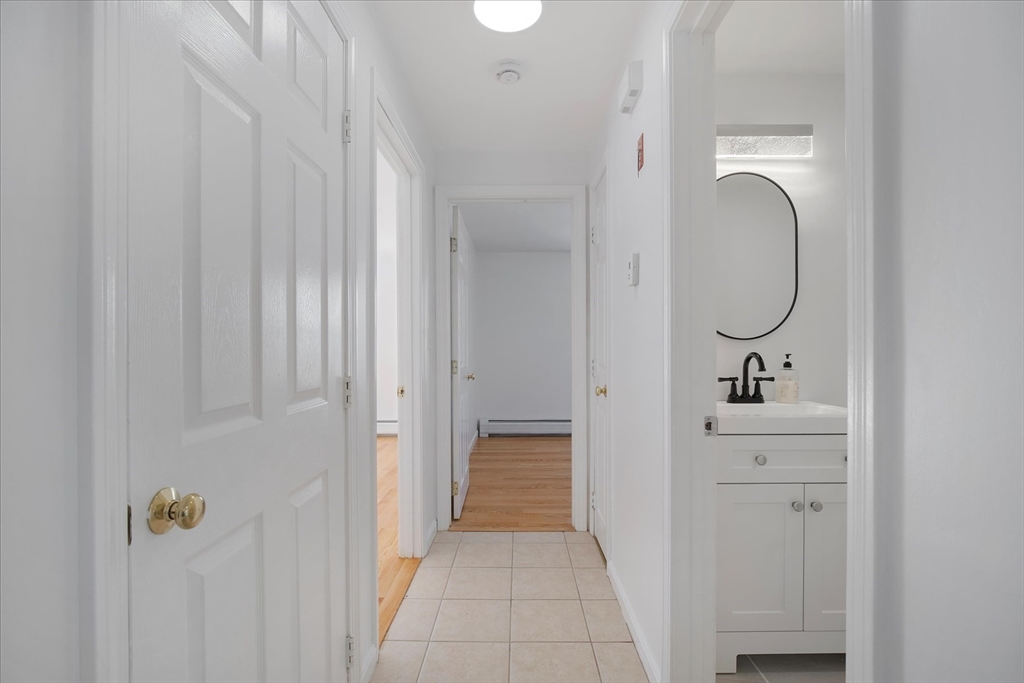 10 Butler Lane Mashpee, MA 02649 - Photo 11 of 42 a bathroom with a sink a mirror and shower