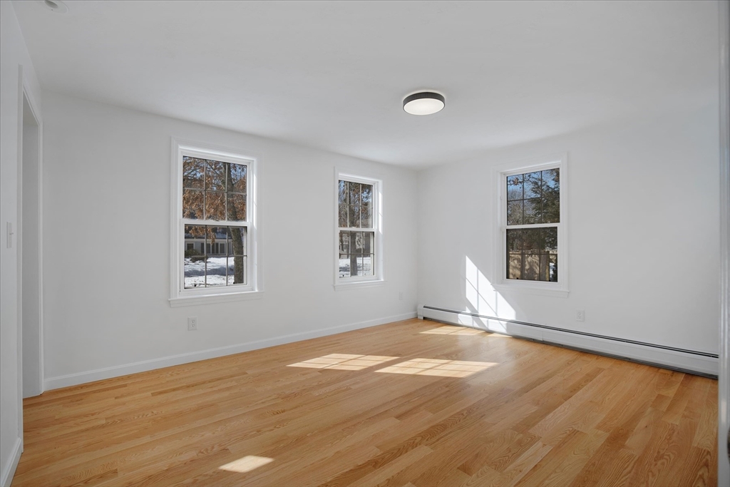 10 Butler Lane Mashpee, MA 02649 - Photo 15 of 42 a view of empty room with wooden floor and fan