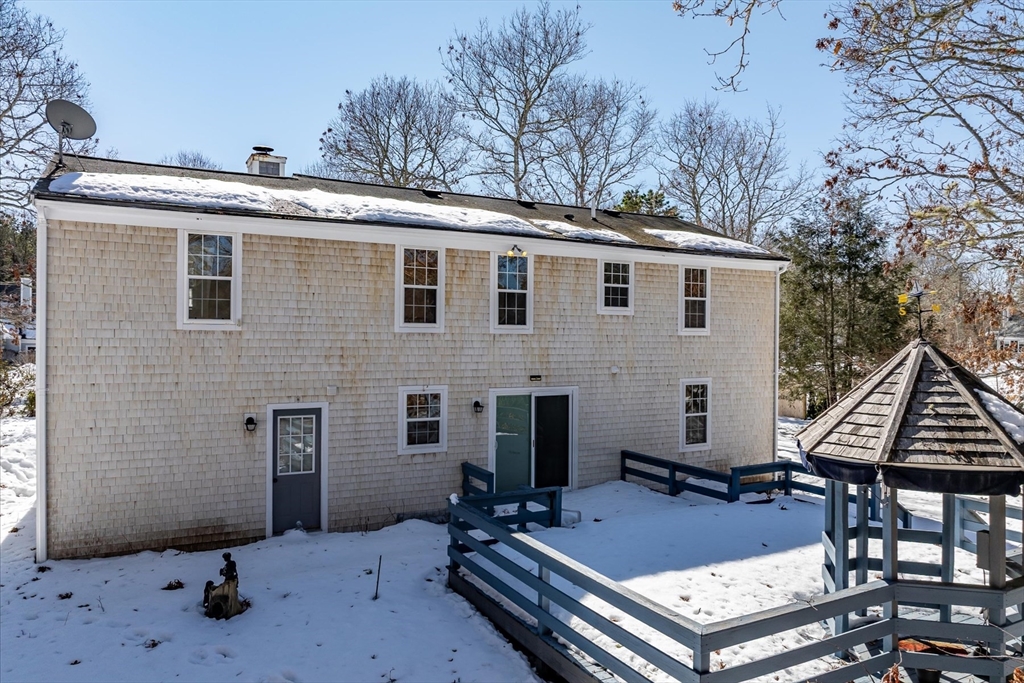 10 Butler Lane Mashpee, MA 02649 - Photo 19 of 42 a front view of a house with patio