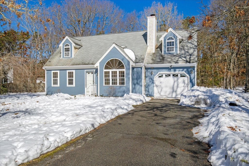 10 Butler Lane Mashpee, MA 02649 - Photo 2 of 42 a front view of a house with a yard