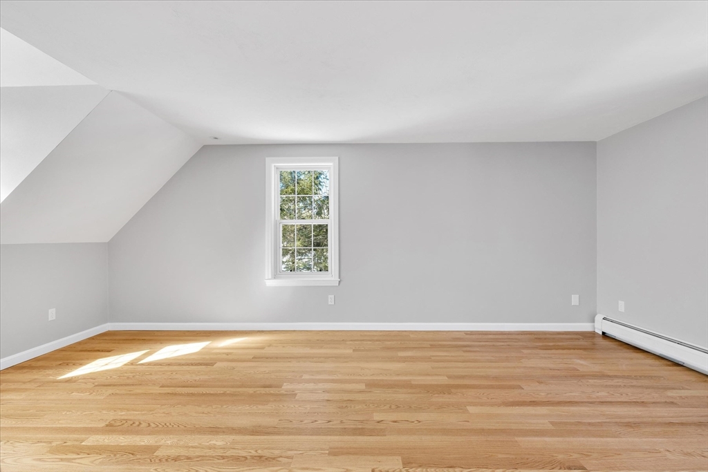 10 Butler Lane Mashpee, MA 02649 - Photo 23 of 42 a view of an empty room with wooden floor and a window