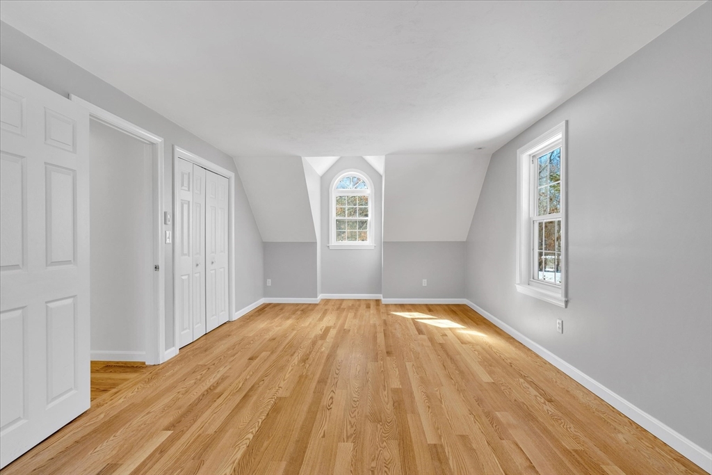 10 Butler Lane Mashpee, MA 02649 - Photo 24 of 42 a view of empty room with wooden floor and fan