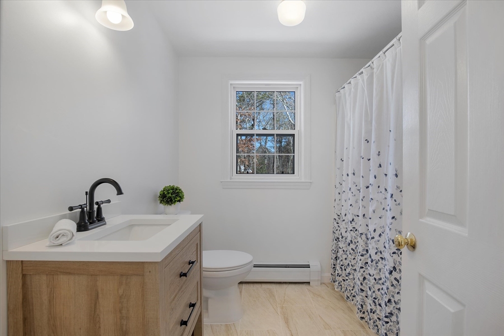 10 Butler Lane Mashpee, MA 02649 - Photo 26 of 42 a bathroom with a sink a toilet and shower