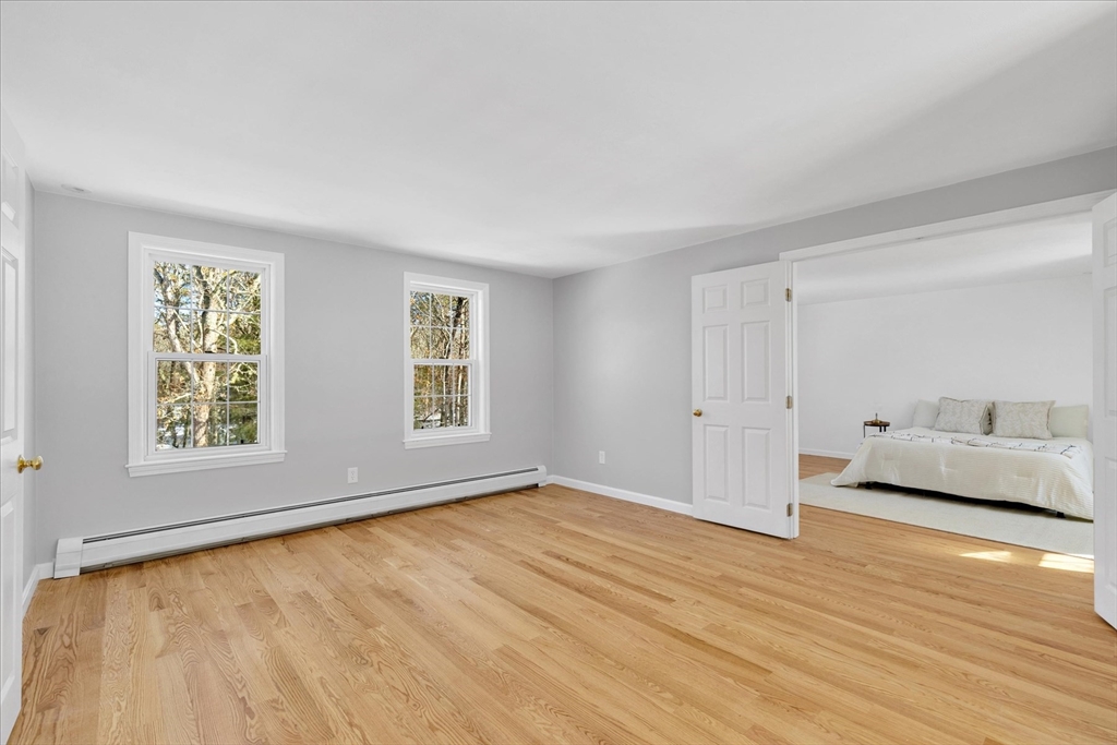 10 Butler Lane Mashpee, MA 02649 - Photo 30 of 42 a view of an empty room with window and wooden floor