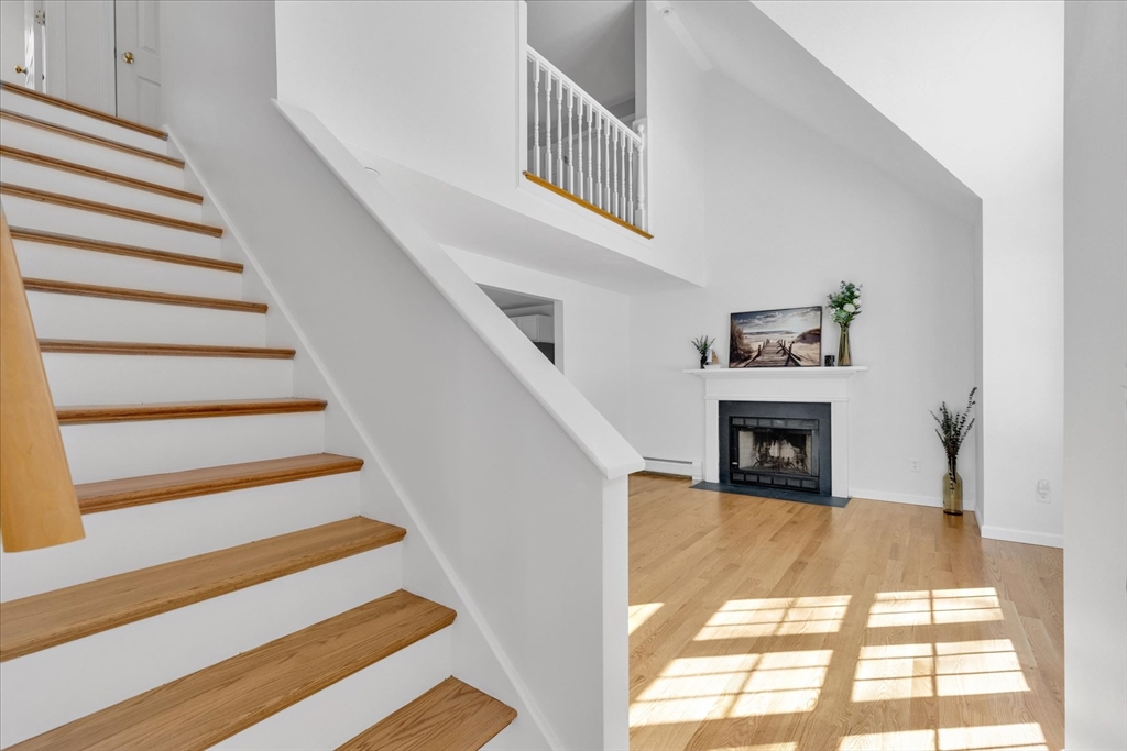 10 Butler Lane Mashpee, MA 02649 - Photo 3 of 42 a view of entryway and hall with wooden floor