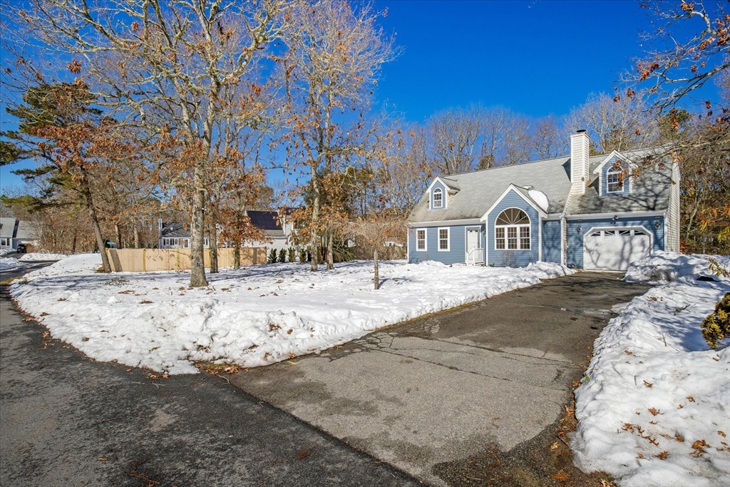 10 Butler Lane Mashpee, MA 02649 - Photo 40 of 42 a view of a white house with snow on the road