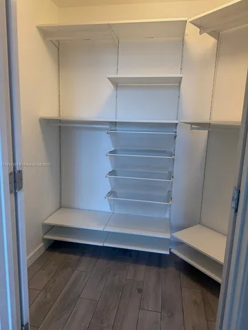 a bathroom with a sink toilet vanity and tub