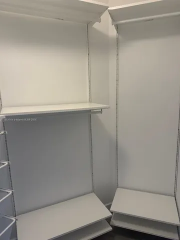 a bedroom with a bed and a cabinets