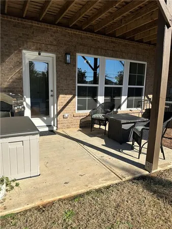 a view of balcony with two chairs and wooden floor