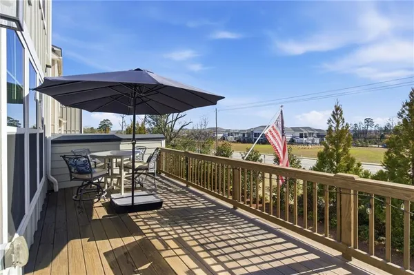 a view of a balcony with wooden floor